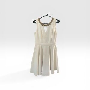 Chic White Sleeveless Dress with Beaded Neckline